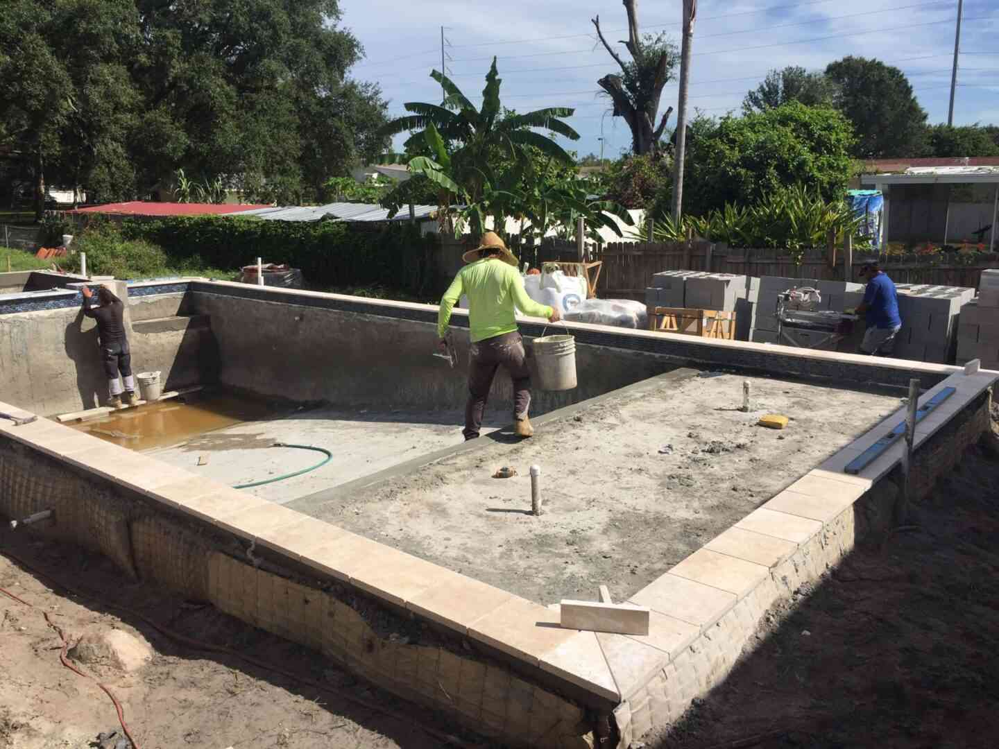 A rectangular pool being constructed