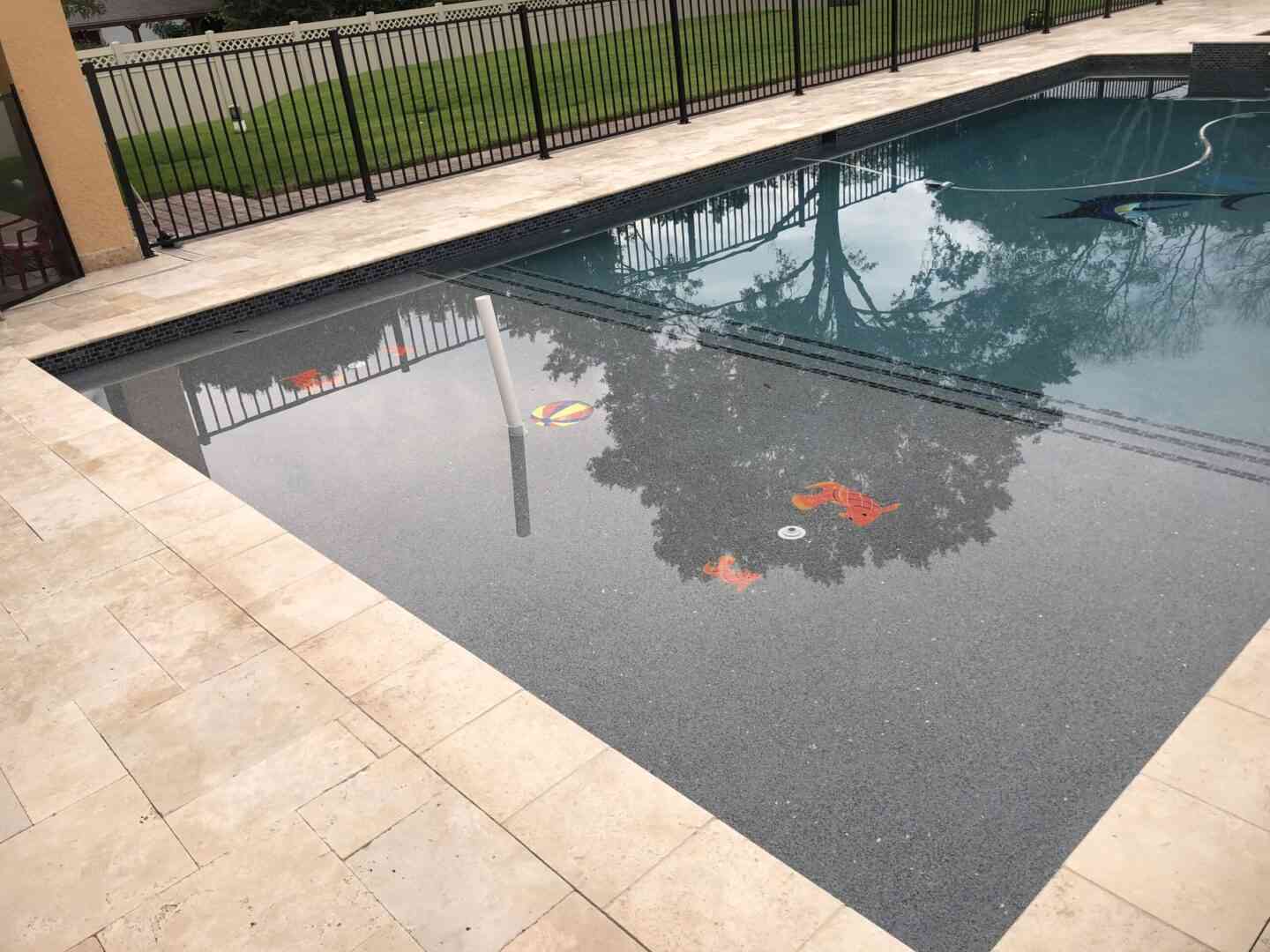 A pool with fish floor designs