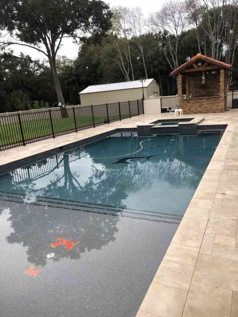 A rectangular pool with fish floor designs