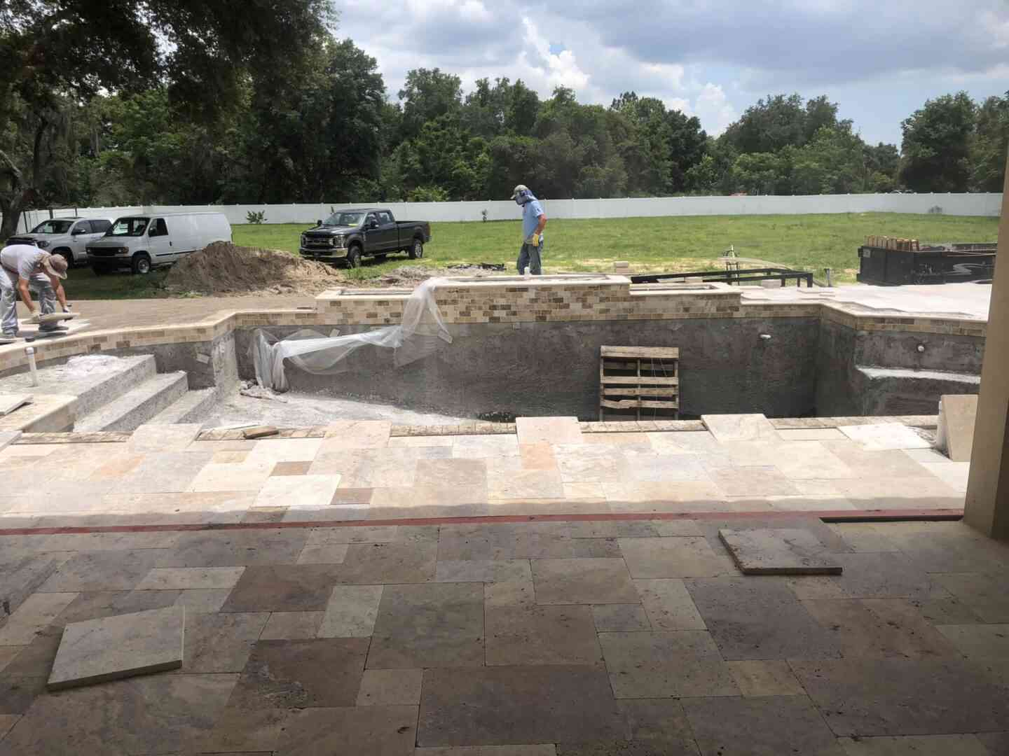 Pool tiles being placed